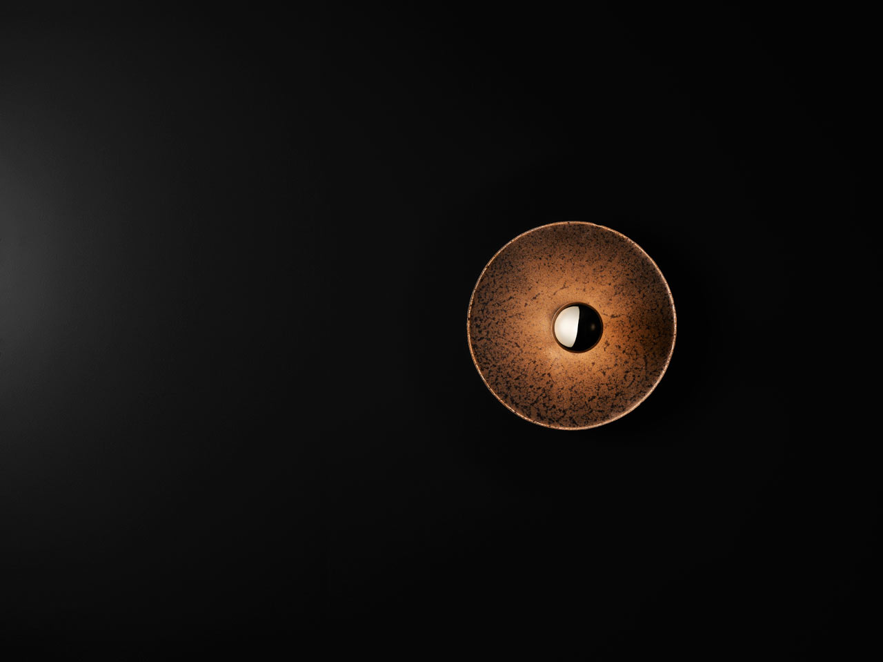 A wall Lamp made from Bluestone