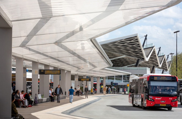 A Bus Station Awning by Day, Solar Powered Lighting Element at Night