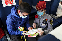 Passengers take customized train to resume work